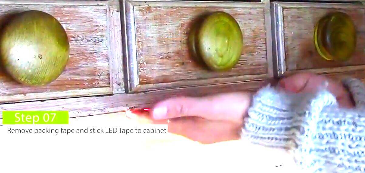 Remove backing tape and stick led tape under the cabinet